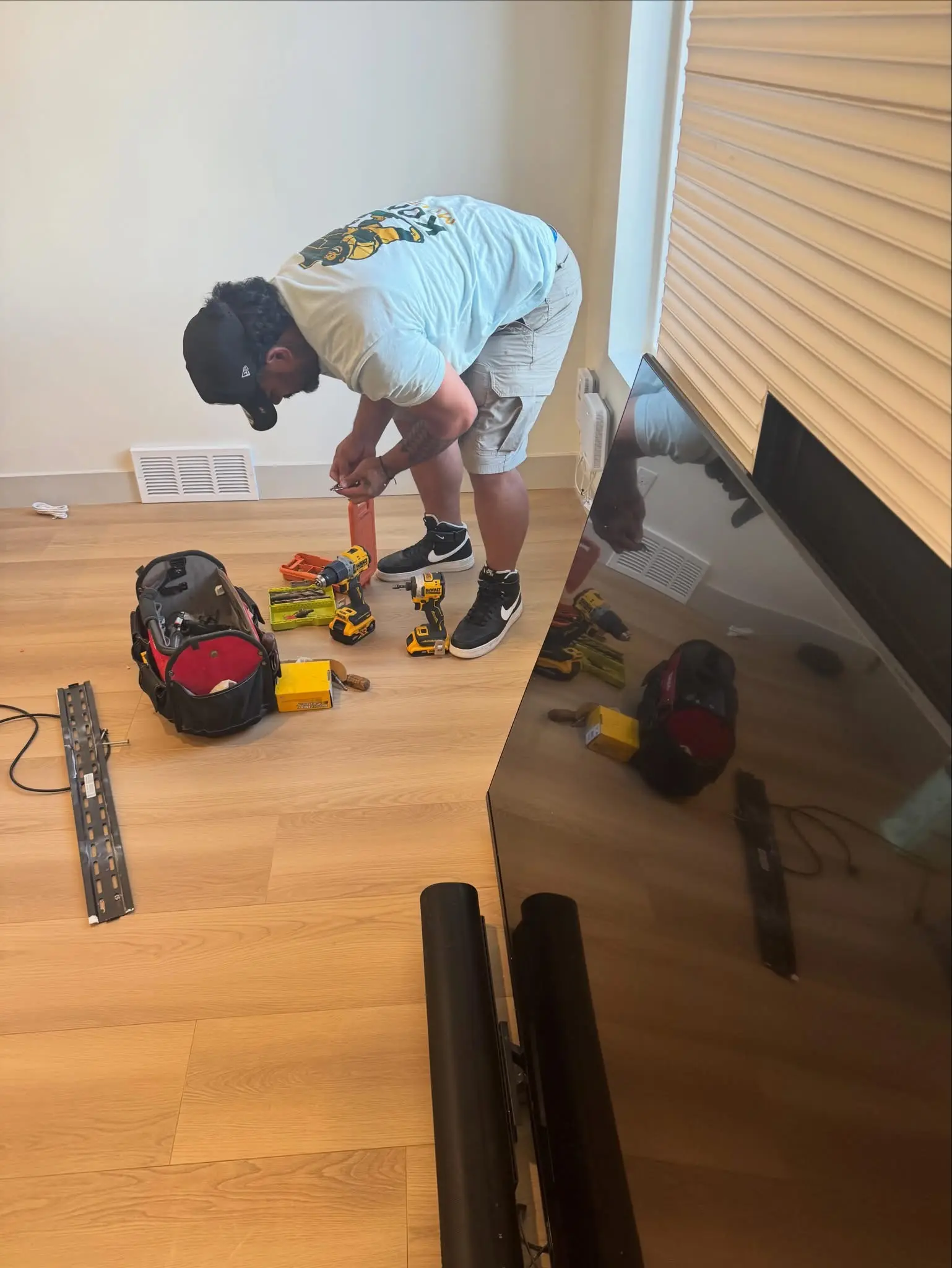 Kong Movers crew doing furniture setup and assembly in a new home in Utah